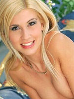 Jenny Sanders in motley bikini strips on terrace